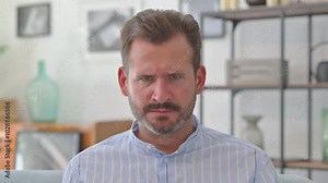 Portrait of Middle Aged Man Screaming and Shouting in Anger