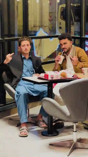 Men Smoking and Eating in Fast Food Restaurant