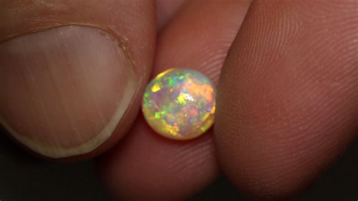 1.6K views · 123 reactions | A sweet Crystal Opal with floral and rolling flash patterns, showing off its 3D play of color inside a high dome. 1.85ct crystal opal 8.5x8x4.5mm https://blackopaldirect.com/product/opal/crystal-opal/1-85-ct-crystal-opal-8-5x8x4-5mm/ | Black Opal Direct | Facebook