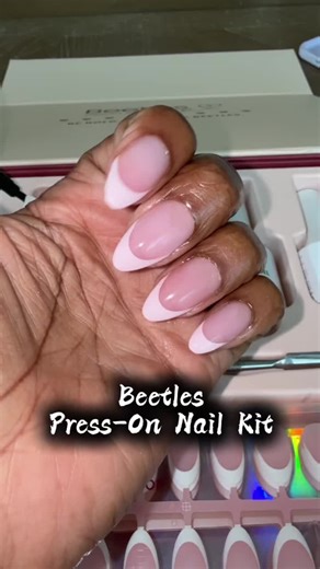 Beetles X Press Plus press on nails kit is a full at-home manicure set with everything you need for a salon-quality French tip look. This kit includes 224 short almond press on nails in 15 sizes with multiple styles like classic French tips, solid colors, and gradient designs so you have options for any look. It also comes with nail glue, builder gel, top coat, cuticle oil, tools, and a mini UV lamp so you can apply and customize your nails easily. Pre-shaped and beginner-friendly, these gel nai