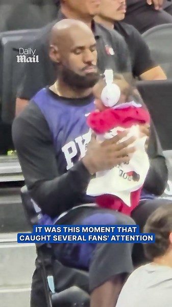 LeBron James holds Tyrese Maxey’s baby on the bench