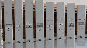 A white xylophone found inside the Orel church. The xylophone is a musical instrument in the percussion family that consists of wooden bars struck by mallets.