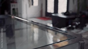 picking up cellphone and keys before exiting room