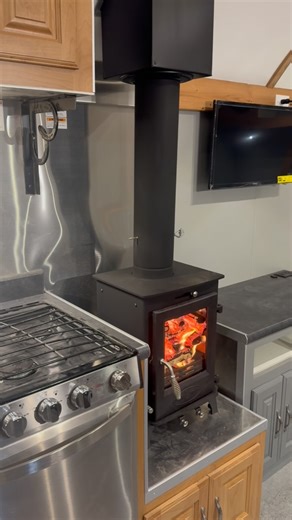 Be honest… would you camp more if your trailer had a wood stove? 🔥 www.peakmtncamps.com #peakmtncamps #woodstoveinarv #truefourseasonsrv #traveltrailer | Peak Outdoors