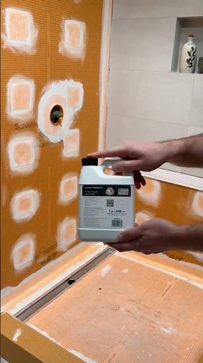 Prepping the surface with PRIMER-PS and installing DITRA-PS for a solid foundation!