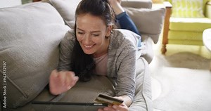 Woman, tablet and credit card on sofa for online shopping, digital payment or fintech success at home. Excited person with yes or fist for e commerce, subscription or sign up on banking app for loan