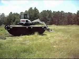 Amphibious Bobcat 337 with cutter