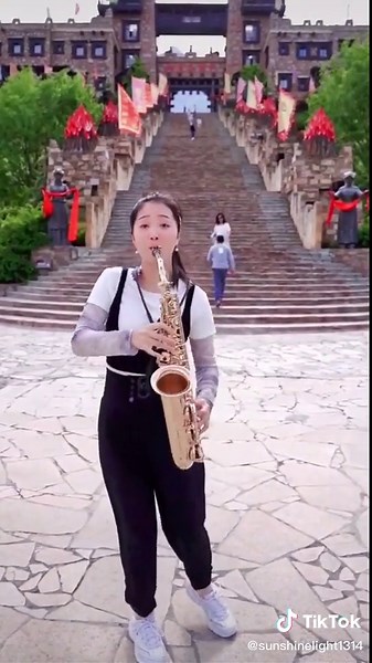 Chinese Girl Playing Saxophone with Passion