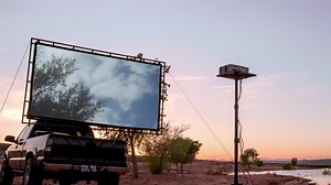 Bring the movie theater anywhere with this portable drive-in projector