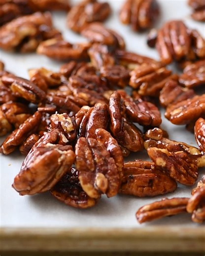 Jazz up your holiday salads with these easy Glazed Pecans. You only need a handful of ingredients including Pecans Maple Syrup and a hint of Cayenne. They'll make your holidays even more delicious! #glazednuts | Garlic and Zest