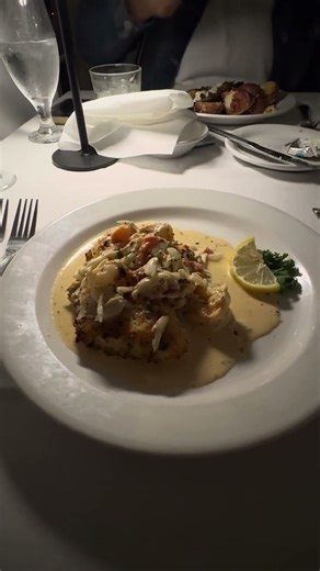 Snapper Topped With Shrimp And Crab Drizzled With A Cream Sauce