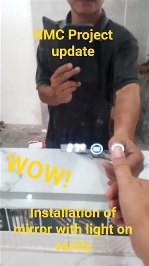 Installation of mirror with lights on vanity #vanitymirror