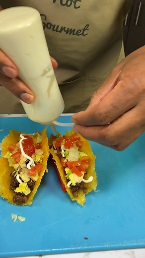 CHEESE TACO SHELLS Shredded Cheddar Cheese Ground Beef Tomatoes Lettuce Cheese Sour Cream Seasoning to Taste Place a circle of cheese on parchment paper and microwave in short increments until melted and golden brown. Hold the paper between two fingers whilst cheese cools and sets into taco shell shape. Fill with taco seasoning. Enjoy! | Definitely Not Gourmet