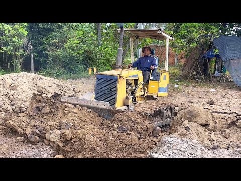 Incredible. Small Bulldozer Pushing Massive Dirt in Deep Trench
