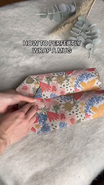 Your guide on how to perfectly wrap a mug! ☕ This doesn't just work for mugs, but any awkwardly shaped gift you may have! #wrappingtutorial #howtowrap #wrappinghack #giftwraphack #wrappingideas #econature #sustainablewrapping #ecofriendly