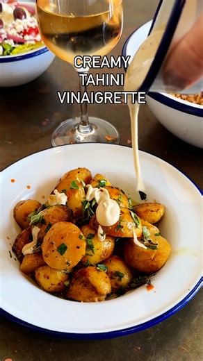 Souvla on Instagram: "Our creamy tahini vinaigrette. Crafted in house for our seasonal summer spiced cauliflower sandwich & salad, but goes great with juicy potatoes too…only available through the end of the month so get it while you can! #souvla #creamytahini #tahini #tahinivinaigrette #eatlocal #sfeats"