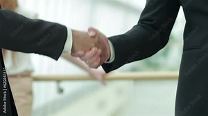 A firm handshake in a meeting