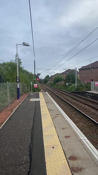 Class 90 freightliner passes whifflet at 18:41