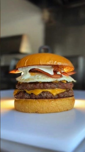 Double smash burger loaded with eggs and bacon #foodshorts #burger