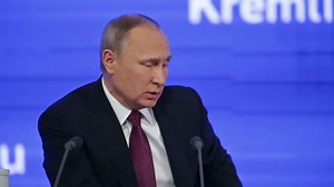 MOSCOW, RUSSIA - DEC 23, 2016: The President of the Russian Federation Vladimir Vladimirovich Putin with eyes closed at the annual press conference in Center of international trade