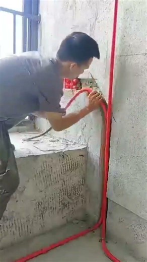 Installing electrical conduits into the wall for wiring