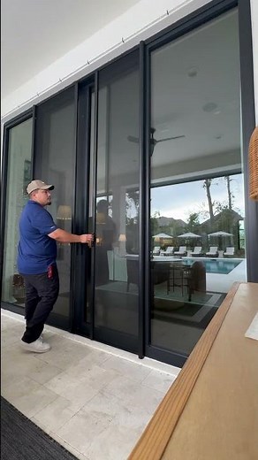 Retractable Phantom Screen doors with floating mesh installed on sliding glass doors