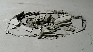 Effect of a circular cracked concrete trying to open up twice from inside from the Impact collection - Debris VFX Video Element.