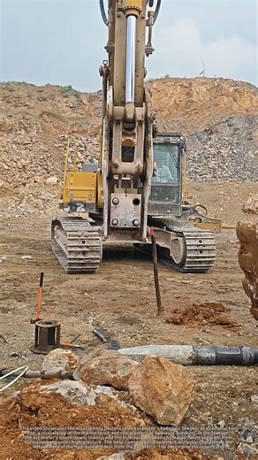 Excavator breaker being disconnected and disassembled