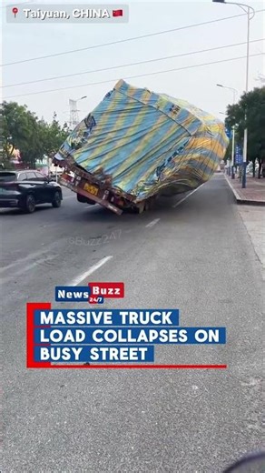 Overloaded Truck’s Massive Load Collapses Neatly on Taiyuan Street in China
