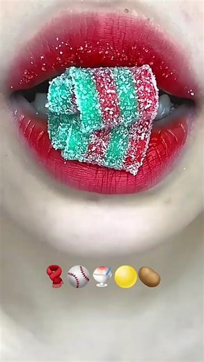 Chewing Candy with Shiny Red Lips: A Close-Up Experience