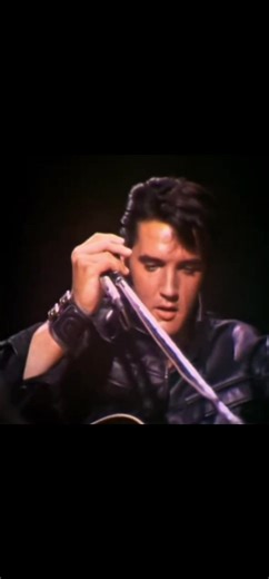 Elvis Presley's Iconic Lip Curl and Black Leather Suit