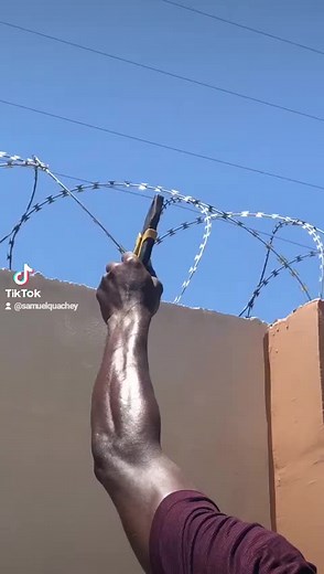 Cutting Barbed Wire: A Close-Up Action Video