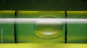 Carpenter's spirit level close up. Measuring the flatness with a spirit level.