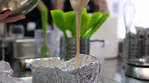 Cake dough. Mixing cake batter in bowl in slow motion. Batter