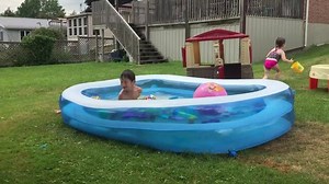 This little boy was trying to run and jump into an inflatable pool. However, when he attempted to jump in, his legs slipped causing him to slip over the pool's edge and into the grass. He burst out laughing as he regained his composure and got back up. | Jukin Copyright Management | Facebook