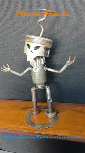 Scrap metal art by NicksKustomFabrications.com Piston Heads Sculpture #099