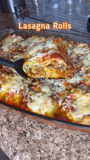 Michelle Disla on Instagram: "The viral lasagna rolls video (year 4!) Lasagna Rolls: I make my regular lasagna following the same exact recipe, just assembled in the traditional, layered way! My ground beef recipe is on my page! 😊 Lasagna Noodles Fresh parsley (about 1 cup) 1 egg 2 cups of ricotta cheese 1 tbsp black pepper 2 sazon packets (or 2 tsp adobo) 2 bags of shredded cheese of your preference #bigmamacooks #groundbeef #lasagna #lasagnarolls"