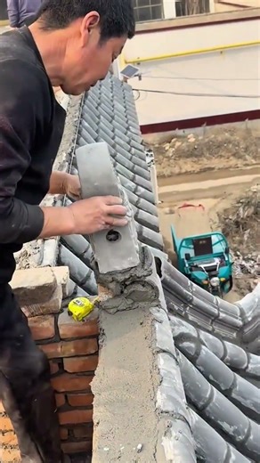 Building a traditional chinese roof with decorative tiles and cement to create a beautiful structure