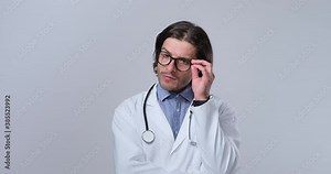 Confused male doctor thinking for a solution to his problems
