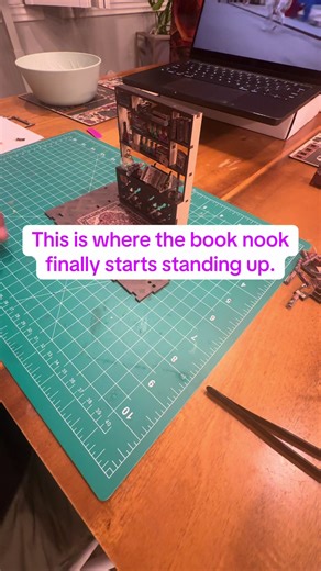 We just took the two furniture pieces we’ve already built and anchored them onto a floor piece, and this is always one of my favorite moments. I love when a book nook starts introducing vertical structure early — it immediately makes everything feel more real and architectural. This House of Magic build is already proving how ornate it’s going to be. Once furniture starts locking into the floor, you can really picture how the space will come together as a full wizard’s room. Things are looking g