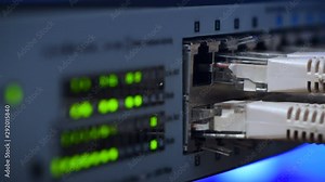 Rack focusing on Ethernet server switches in Data Center sending and receiving data over the Ethernet. 4K UHD Video.