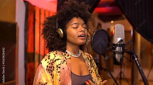 Singer recording new song in professional studio