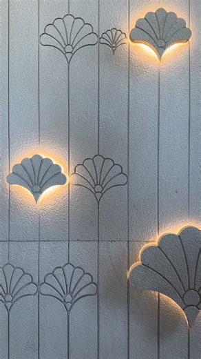 Stone Ideas - Interior Exterior Wall Decor on Instagram: "Staircase walls are a vast expanse of space that demand some creative attention, which is where these staircase wall design ideas come in. When client said ‘In our home, we wanted to bring a more classic, but voguish, feel to the staircase, making it far more than just a way up and down.’ This backlit engraved and embossed stone flower 🌷 design keeps the interior space up to date and rejuvenates the staircase area. Imagine starting your 