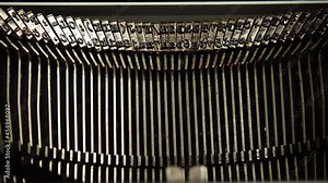 Mechanism of a retro typewriter. Old typewriter hammers. Close up.