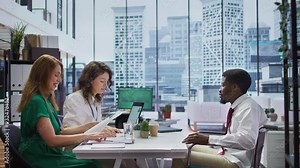 Candidate with chronic impairment attending a job interview in disability friendly office, discussing with the HR team about career development. Equal chances of employment. Camera B.