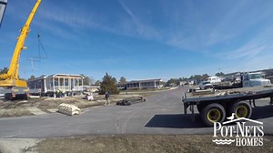 Give a warm welcome to E-129 Sloop- Bayside's latest addition! This home provides a view directly overlooking the marina and will serve as the perfect waterfront retreat for it's future owner(s)! | Pot-Nets