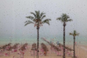 This Company Will Pay for Your Vacation If It Rains — What to Know