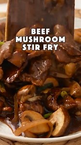 Delicious beef and mushroom stir fry recipe. Ingredients Beef steak - 300 grams Mushroom - 250 grams Onion - ½ Ginger - 3-4 slices Dried crushed chillies - 1 tsp Spring onions ( green onion/scallion ) - 2-3 Cooking oil 2-3 tbsp Garlic 2-3 cloves Sesame oil 1 tsp Beef Marinade Ingredients Grated ginger - 2 tsp Regular soy sauce - 1 tbsp Sugar - 2 tsp Cornstarch - 1 tbsp Cooking oil - 1 tbsp Baking soda - ½ tsp ( half tsp ) White pepper - ¼ tsp For Sauce Oyster sauce - 3 tbsp Regular soy sauce - 1