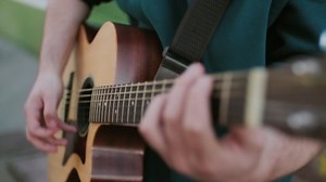 clip-1069387177-close-shot-handheld-tracking-bearded-young-man