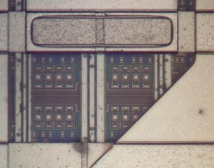 Teardown of a logic chip from a vintage IBM ES/9000 mainframe